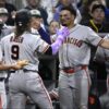 Giants manager Tony Vitello soaks up his first major league victory in bare feet