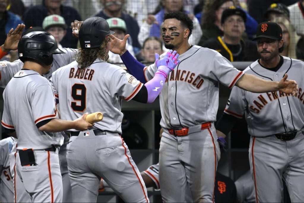 Giants manager Tony Vitello soaks up his first major league victory in bare feet