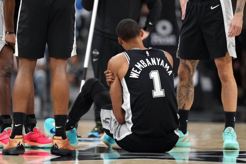 Victor Wembanyama leaves Spurs-76ers game with left rib contusion after hurting shoulder